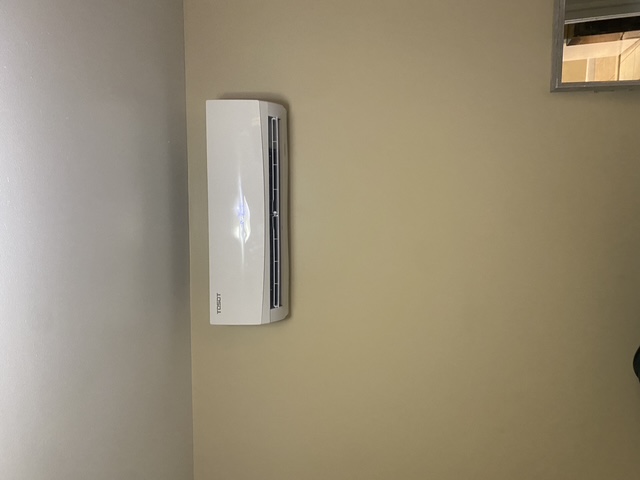 Completed indoor ductless mini-split wall unit installation